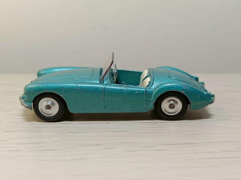 Model Kit of a 1957 Ford Thunderbird for Hobbyists to Assemble and Customize302 MGA in metallic blue-green with shaped wheels